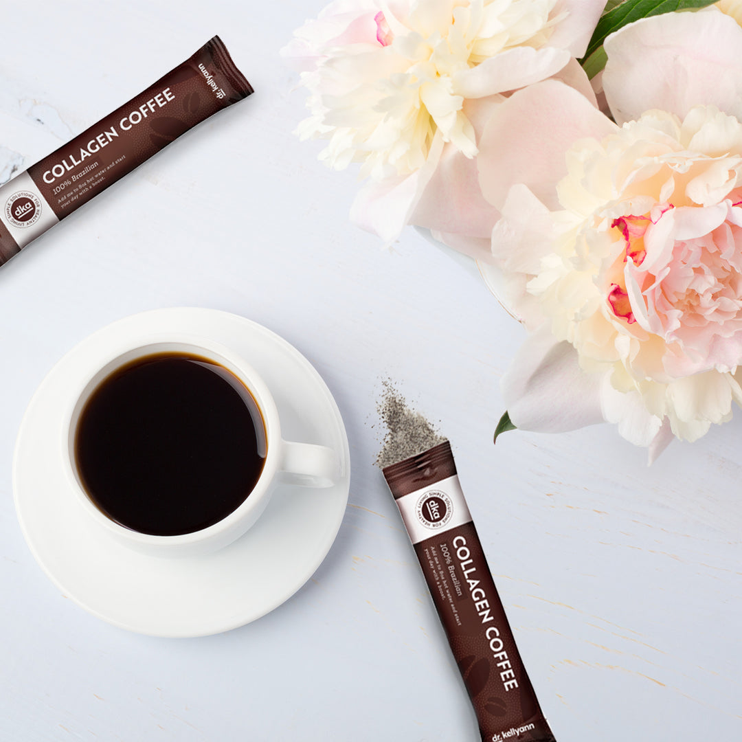 Collagen coffee on a table with flowers