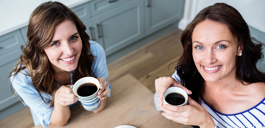 Two friends drinking coffee