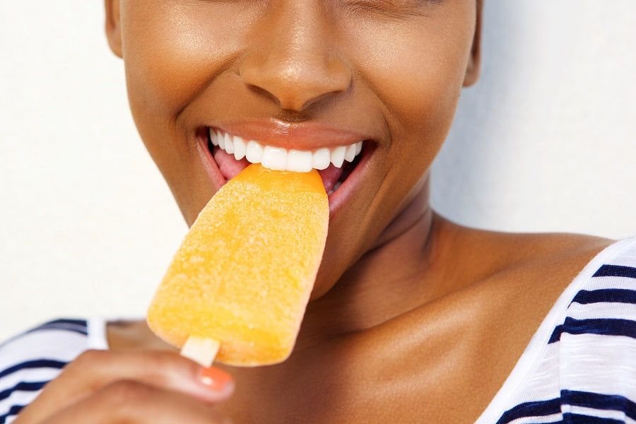 Woman eating a popsicle