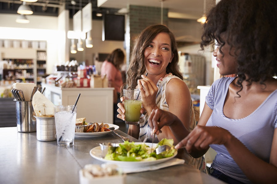 Two women eating out at a restaurant
