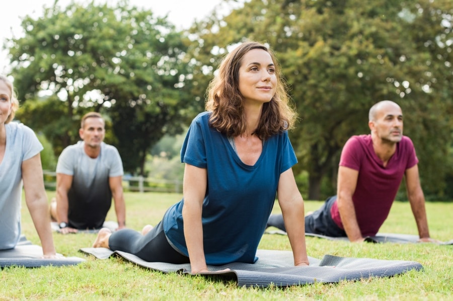 People doing yoga outdoors