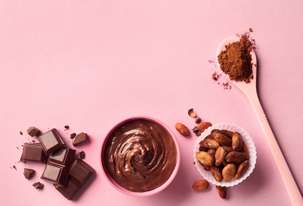 Dark chocolate bar for weight loss on a wood table with a spoon 