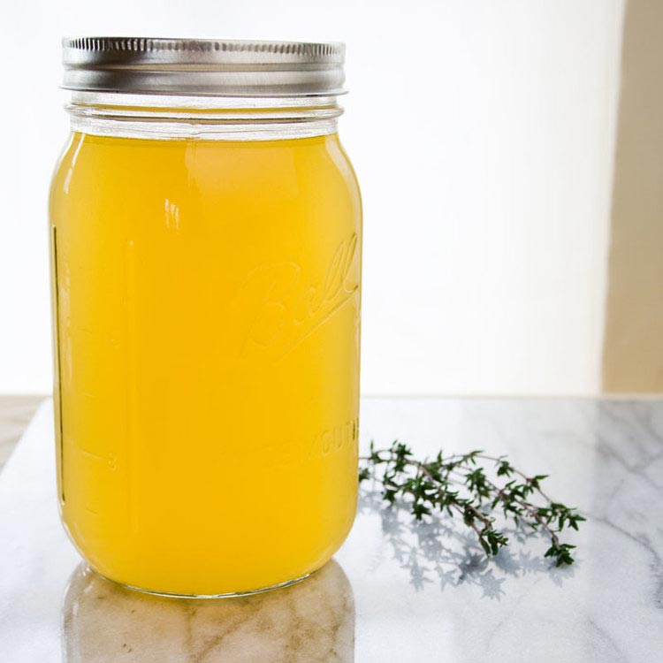 Glass jar of chicken bone broth