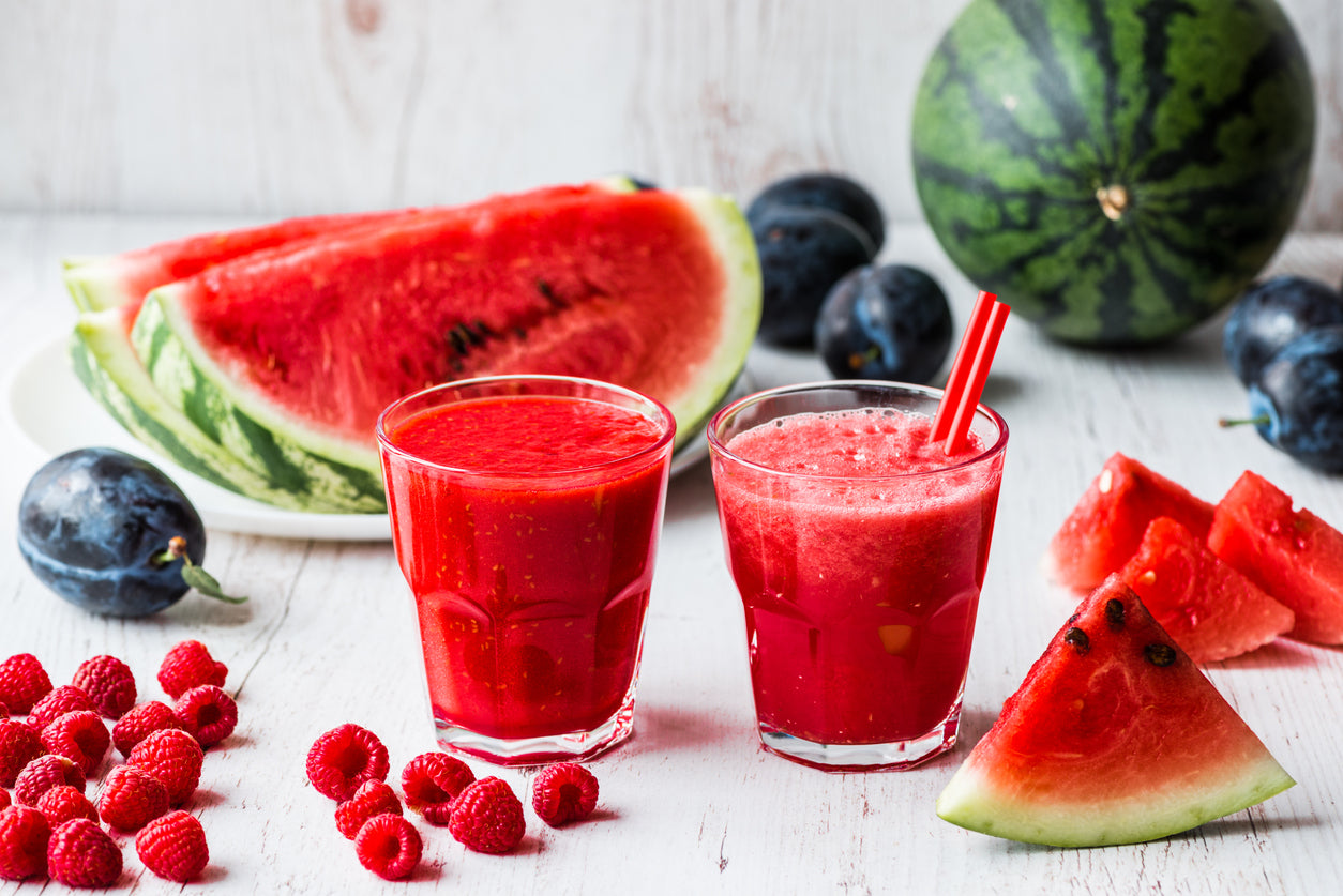 cleanse and reset smoothies with a variety of fruits on table