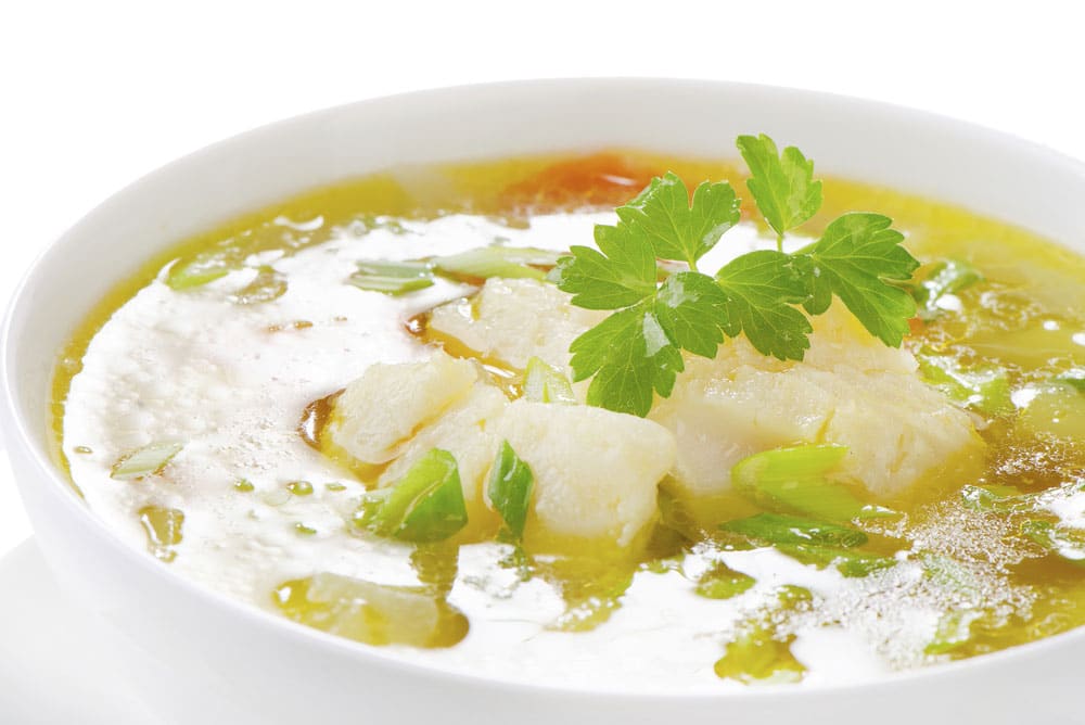 Broth with fish and garnish
