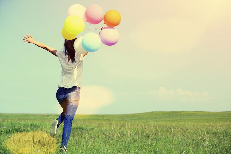 woman-running-with-balloons