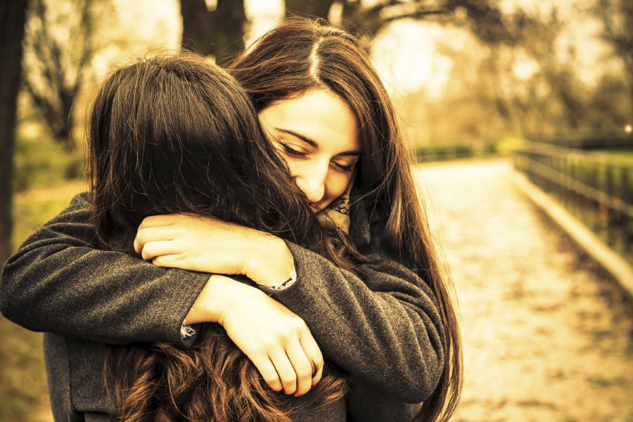 Two girls hugging