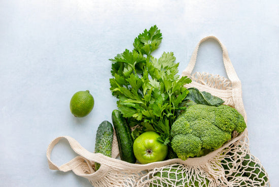 grocery shopping bag full of greens