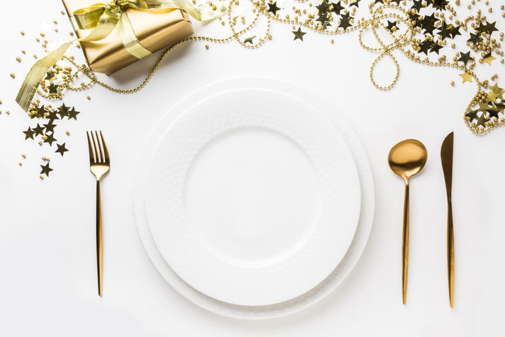 plate setting with gold silverware