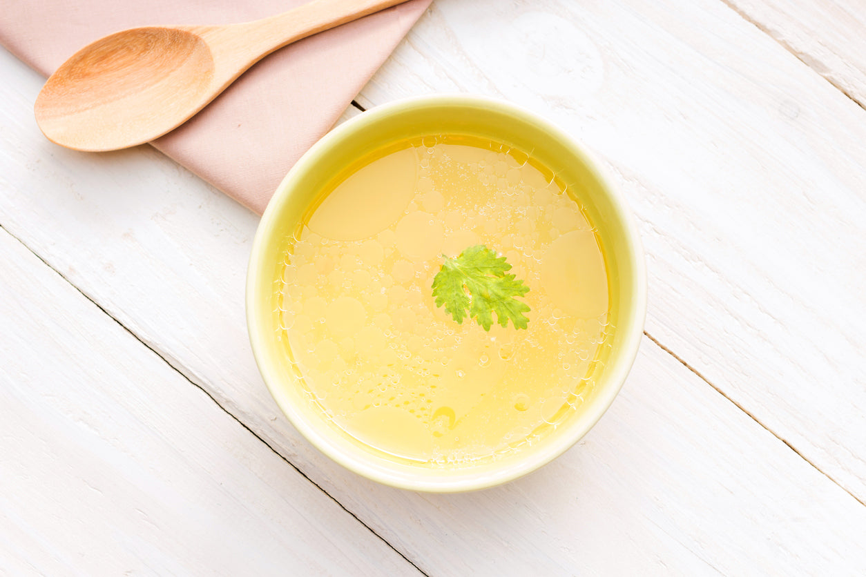 soup with wooden spoon