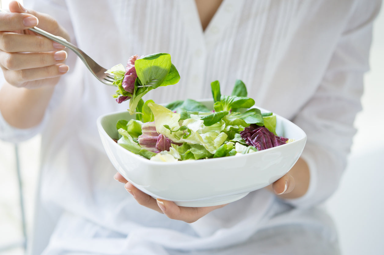woman eating a salad