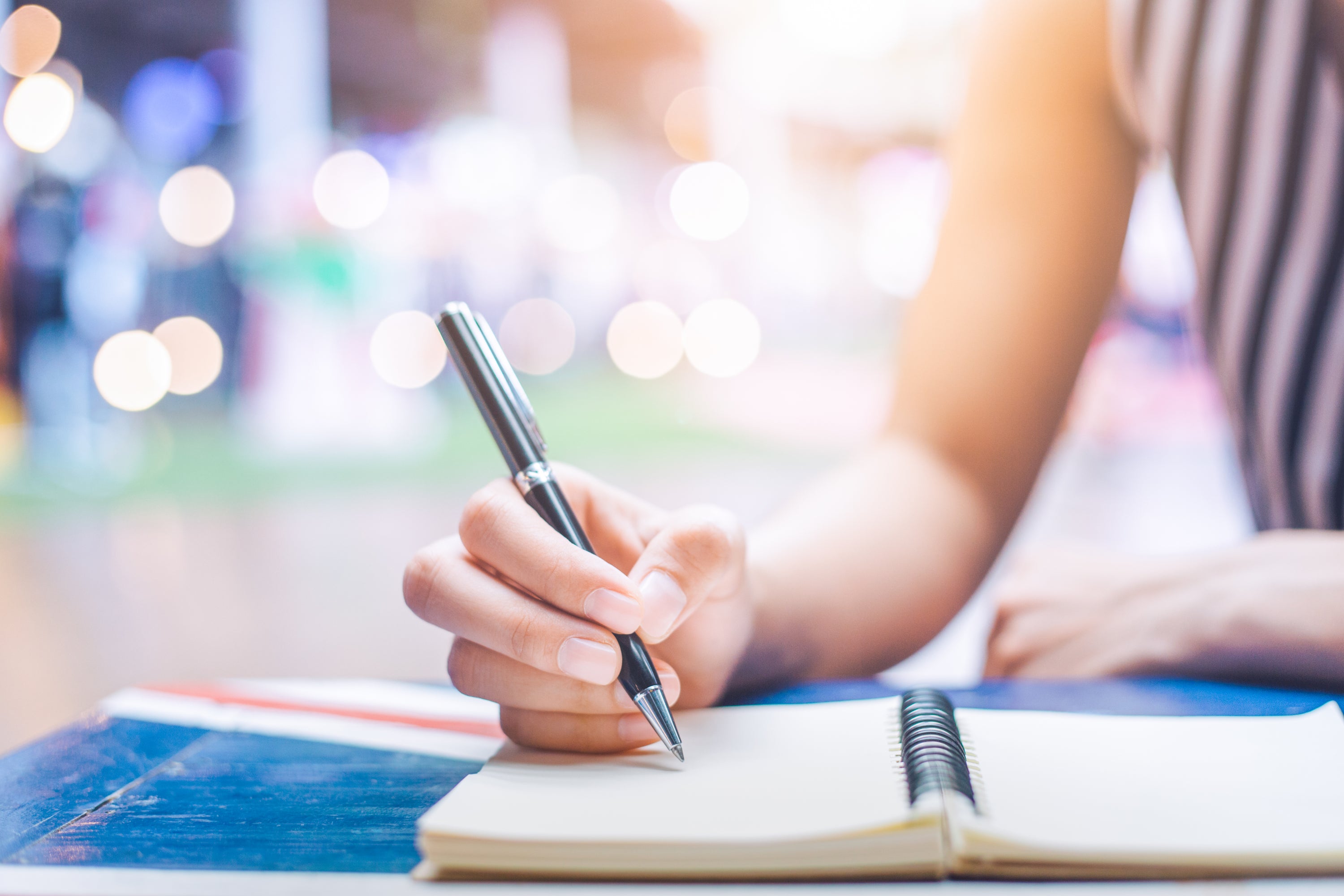 Woman writing in a journal