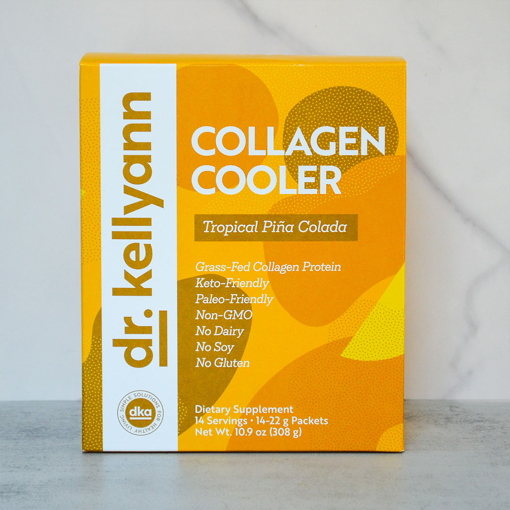 Box of Dr. Kellyann Collagen Cooler in Tropical Piána Colada flavor on a gray background