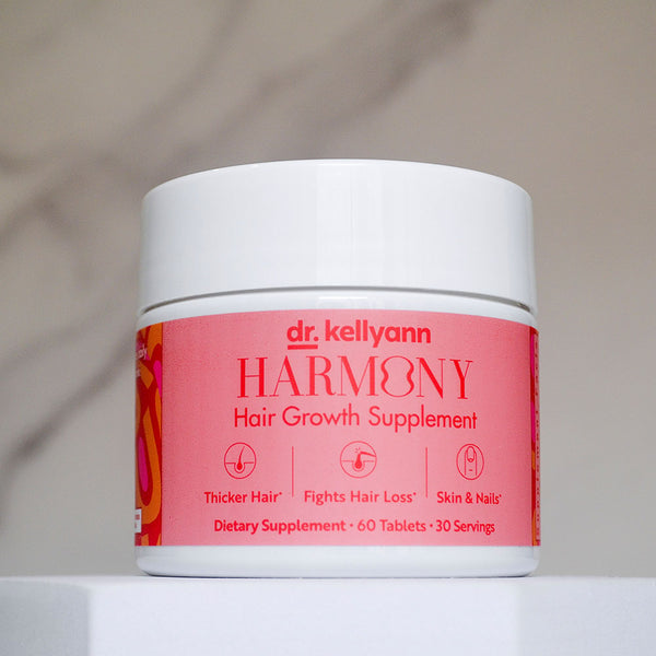 Dr. Kellyann Harmony hair growth supplement jar on a neutral background