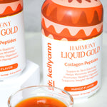 Two bottles of Dr. Kellyann Harmony Liquid Gold Collagen Peptides with a small glass containing the product.
