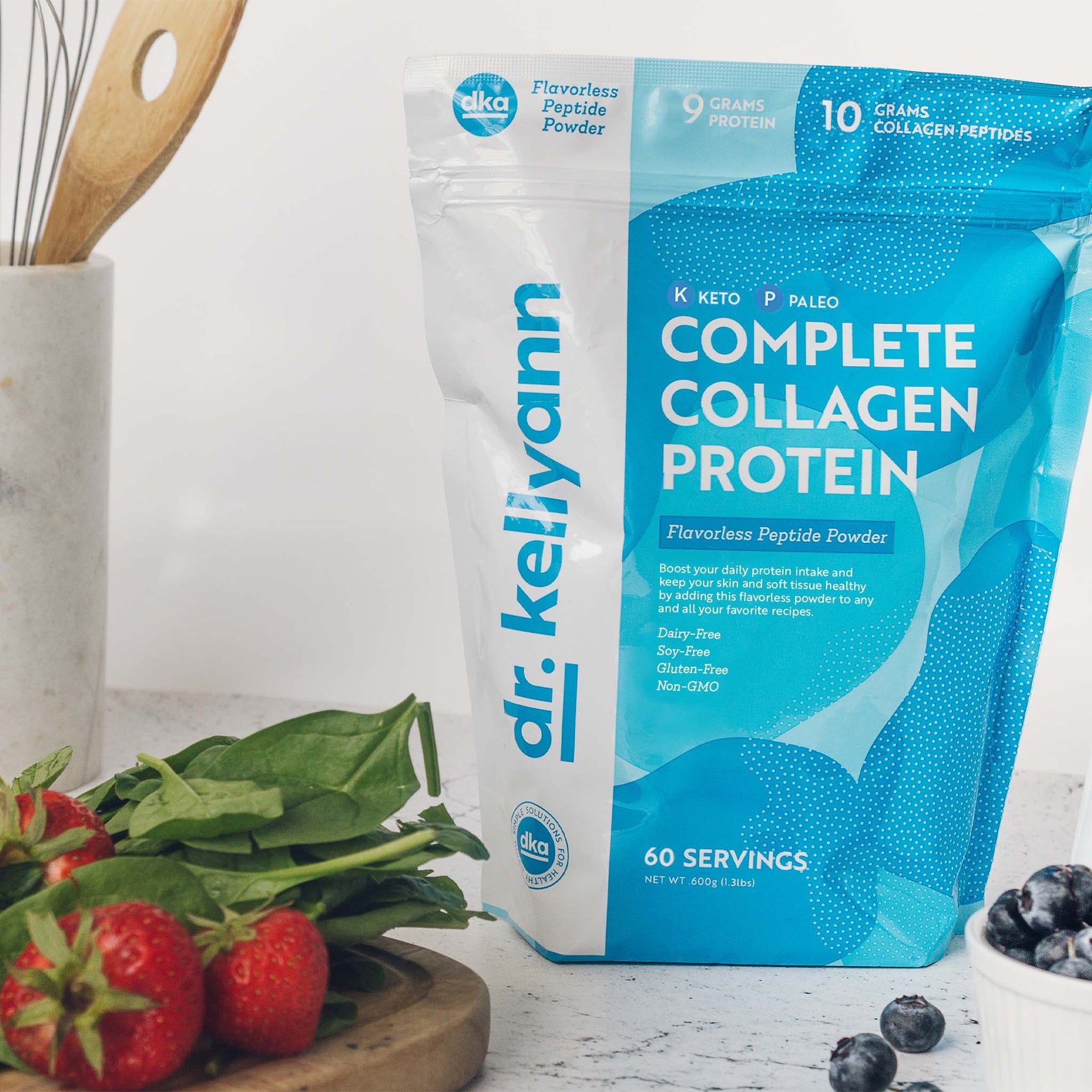 Complete Collagen Protein Package next to strawberries and cooking elements 