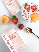 Collagen Shake - Vanilla Almond package on a table next to a bowl with fruits