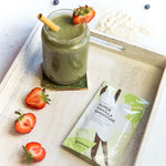 Super Vanilla Smoothie on a table with a smoothie