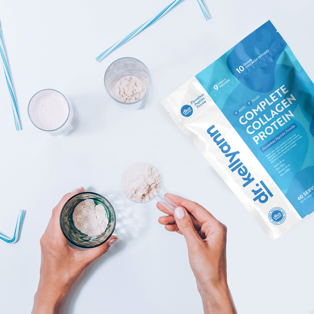 Dr. Kellyann Complete Collagen Protein bag, with prepared protein drinks and straws on a white surface.”